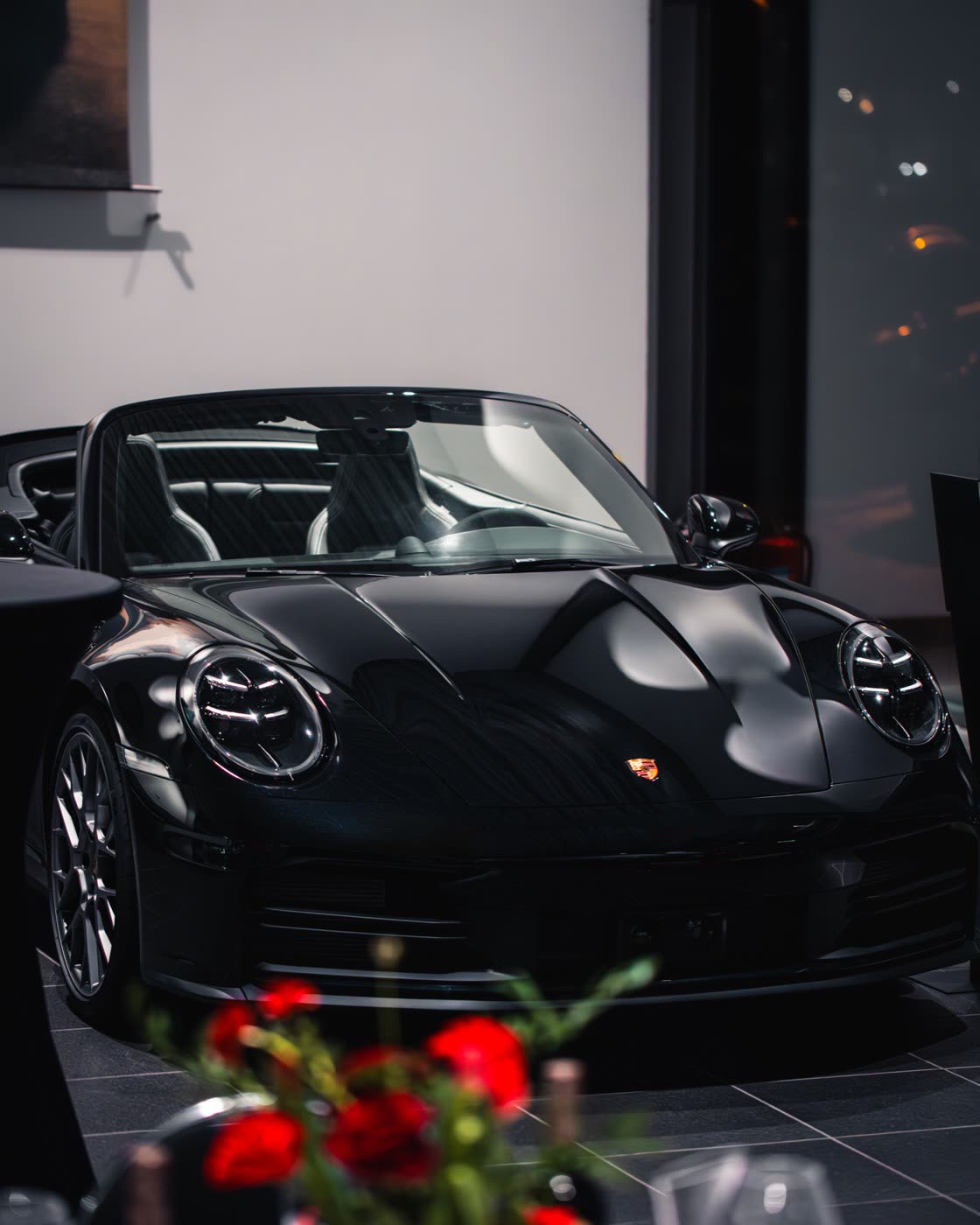 Black Porsche 911 Cabriolet on display at Porsche Center Kalmar showroom