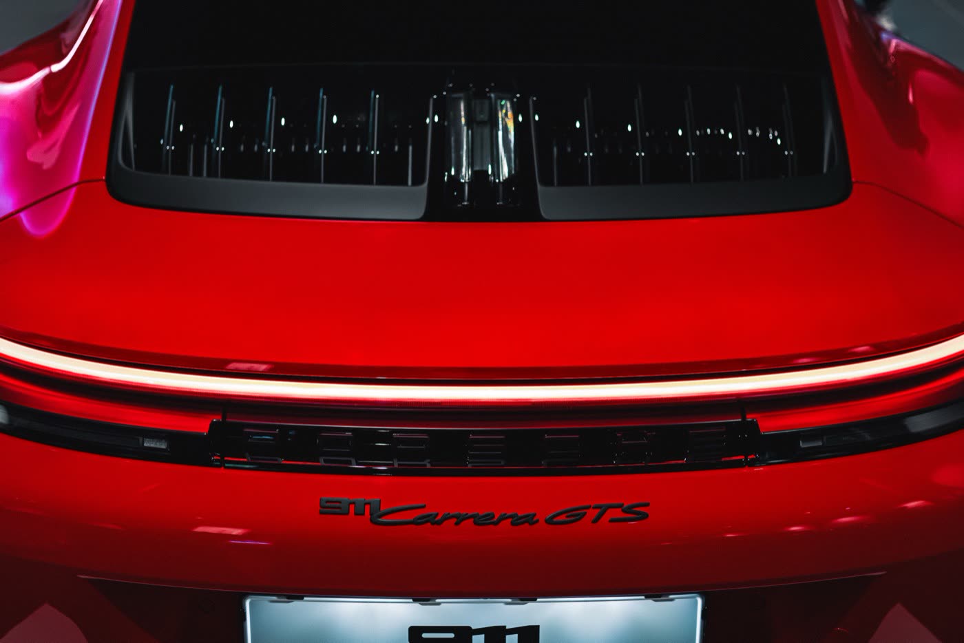 Rear close-up of red Porsche 911 Carrera GTS at Porsche Center Kalmar