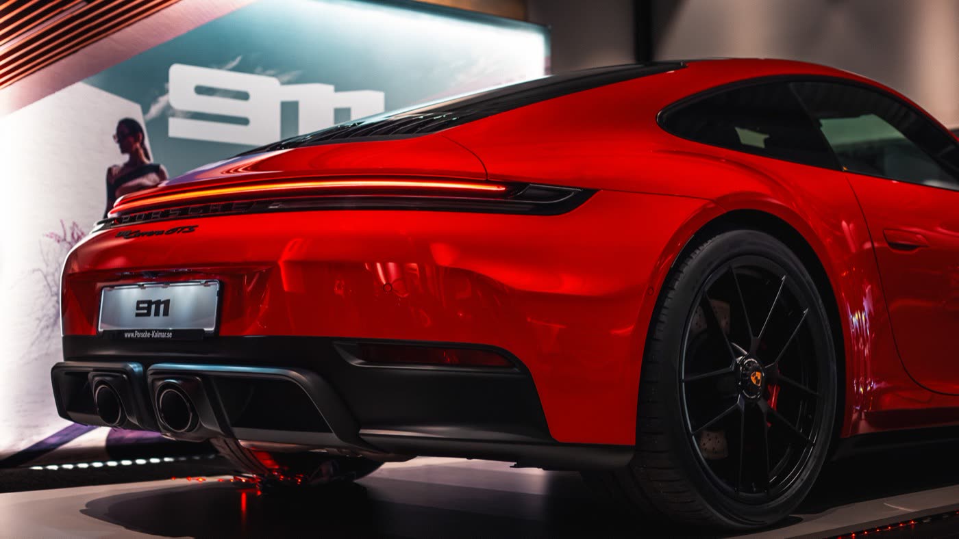 Rear three-quarter of red Porsche 911 Carrera GTS at Porsche Center Kalmar
