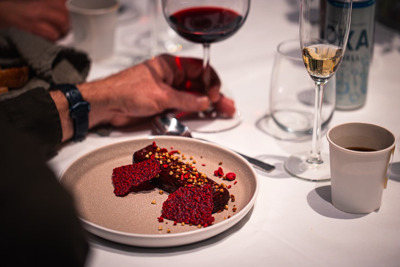 Aerial top-down of Porsche Macan Electric and guests at Porsche Center Kalmar reveal