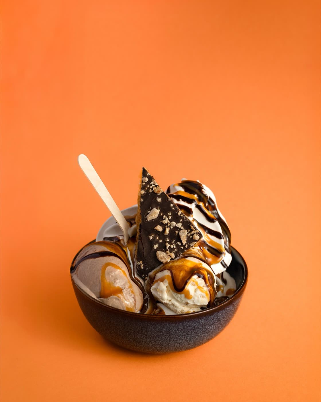 Italian salami sandwich with grilled peppers and basil on a wooden board, Togo Kalmar