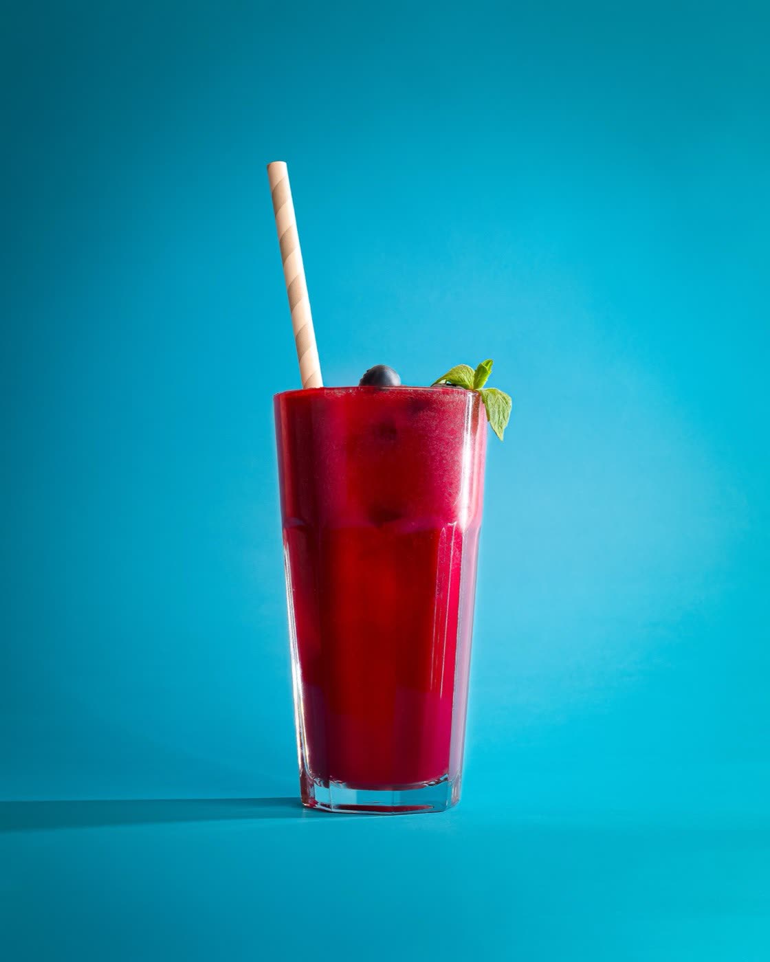 Togo branded paper coffee cups with takeaway pastries on pink, café branding photography Kalmar