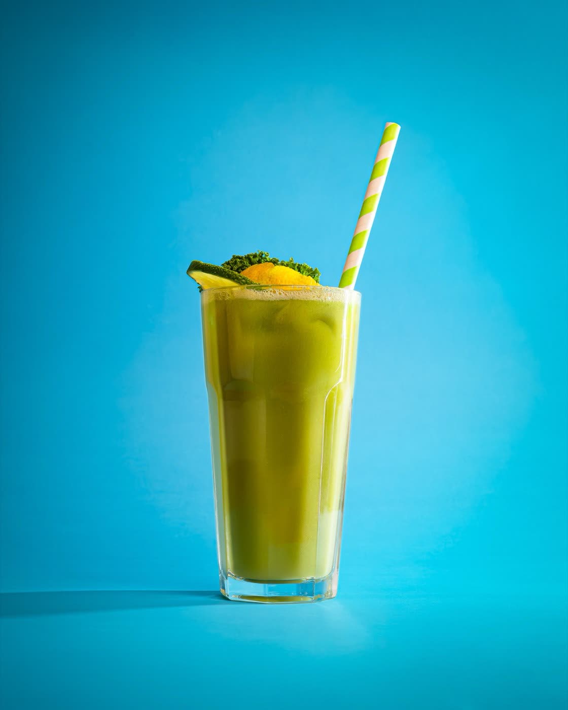 Strawberry milkshake with donut and waffle topping on blue, Togo Kalmar