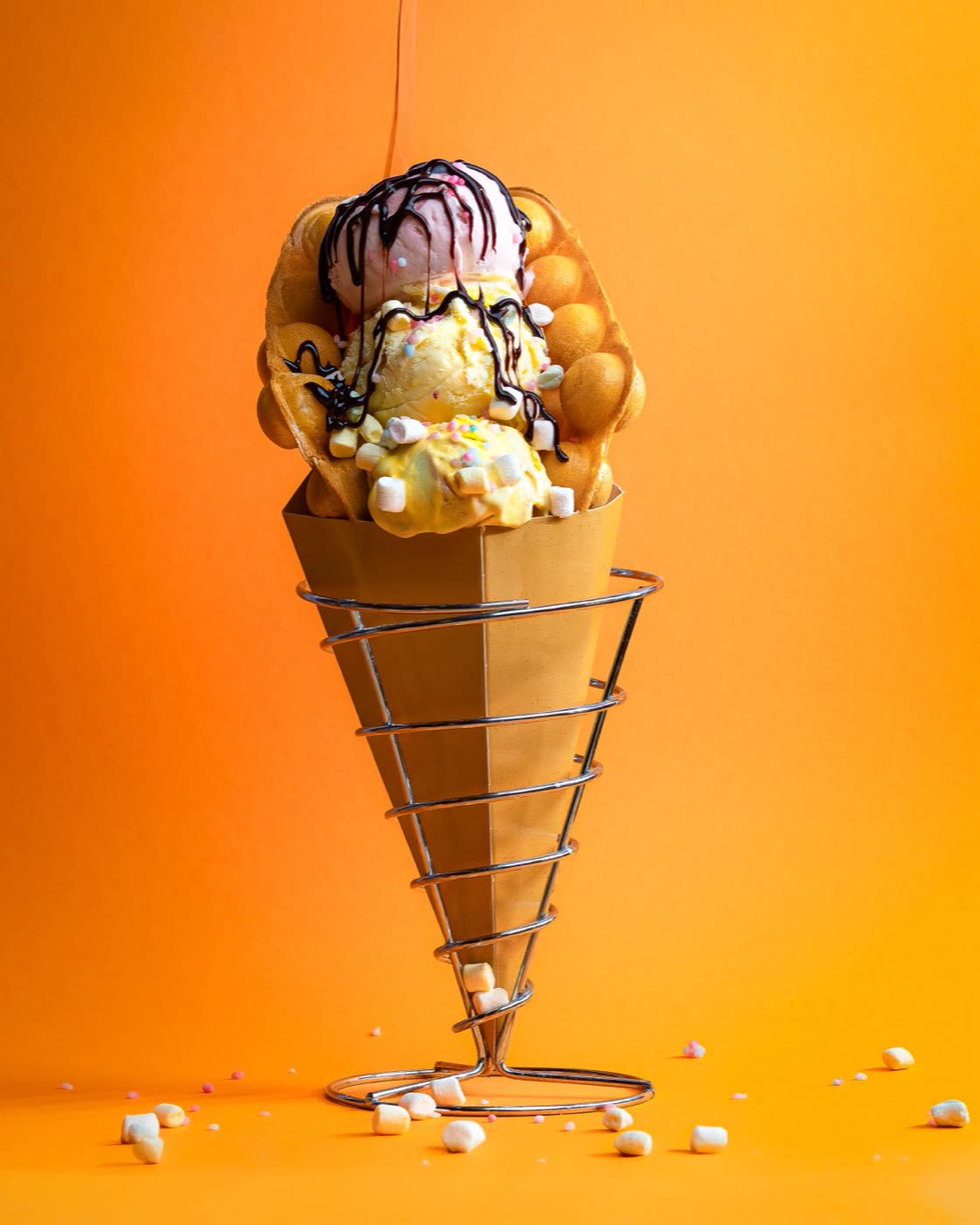 Banana split with chocolate, strawberry and vanilla ice cream and rainbow sprinkles, Togo Kalmar