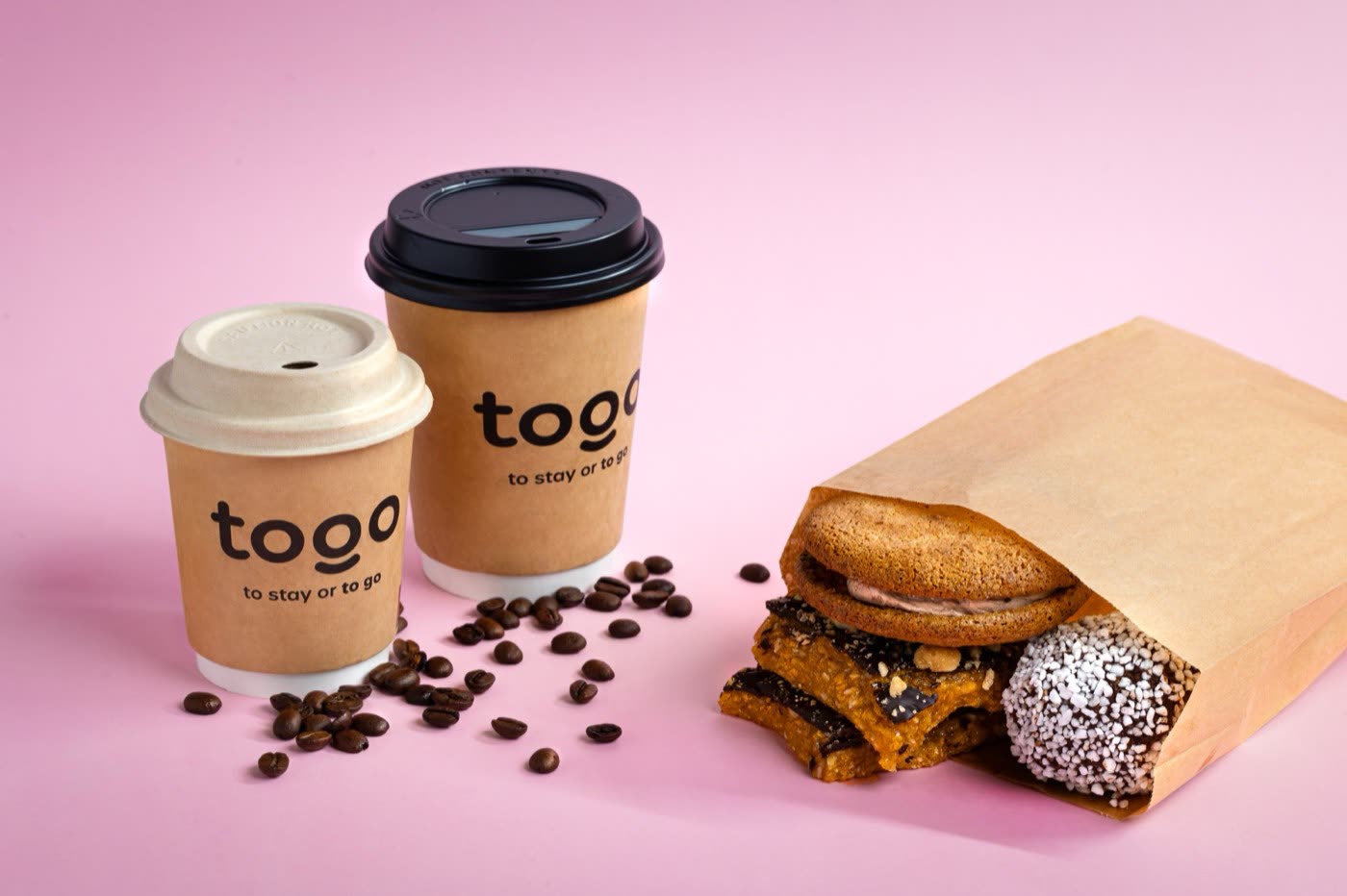 Mango and passionfruit smoothie in a tall glass on blue, Togo Kalmar drinks menu