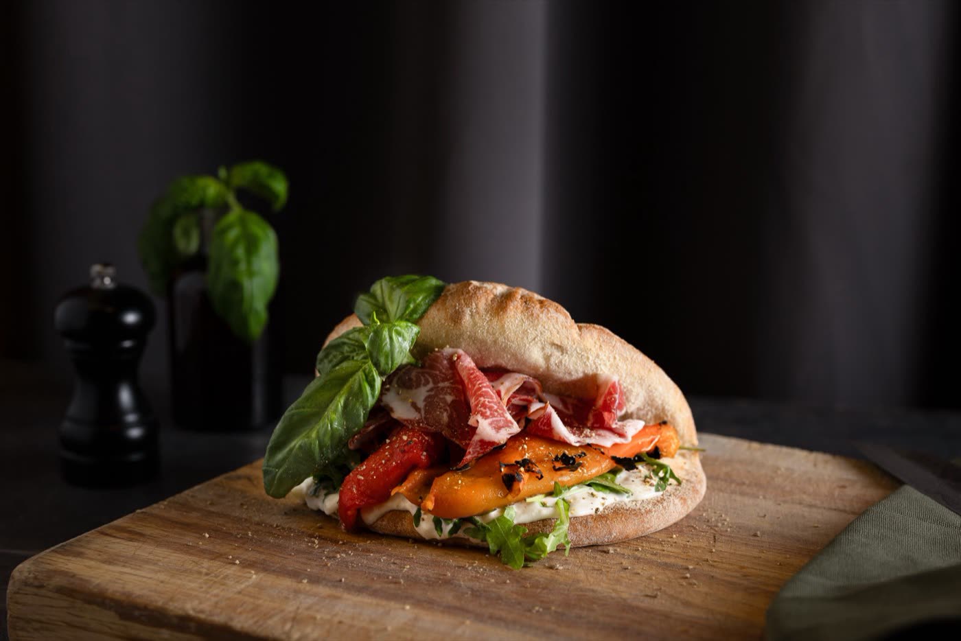 Salmon and mango poke bowl with avocado and edamame in a stone bowl, Togo Kalmar